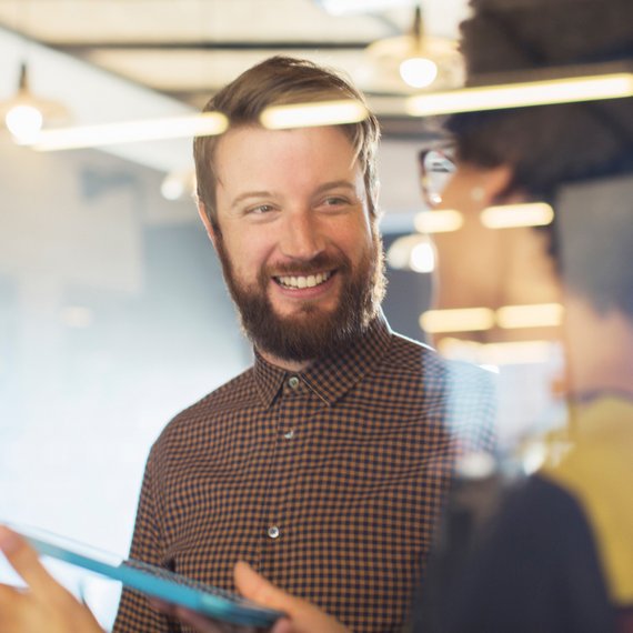 Person holding tablet in office