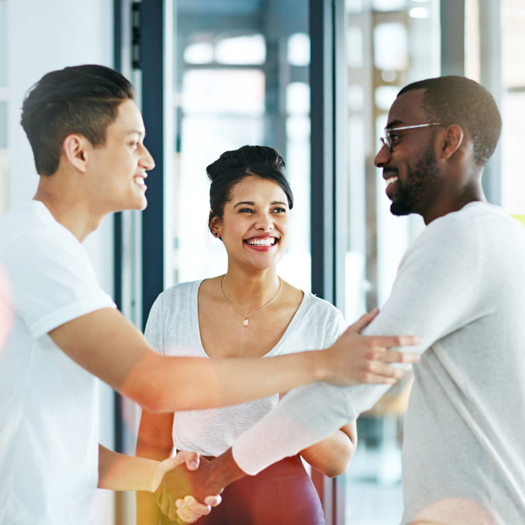 Three individuals engaged in a conversation